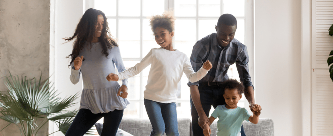 Family dancing in the living room