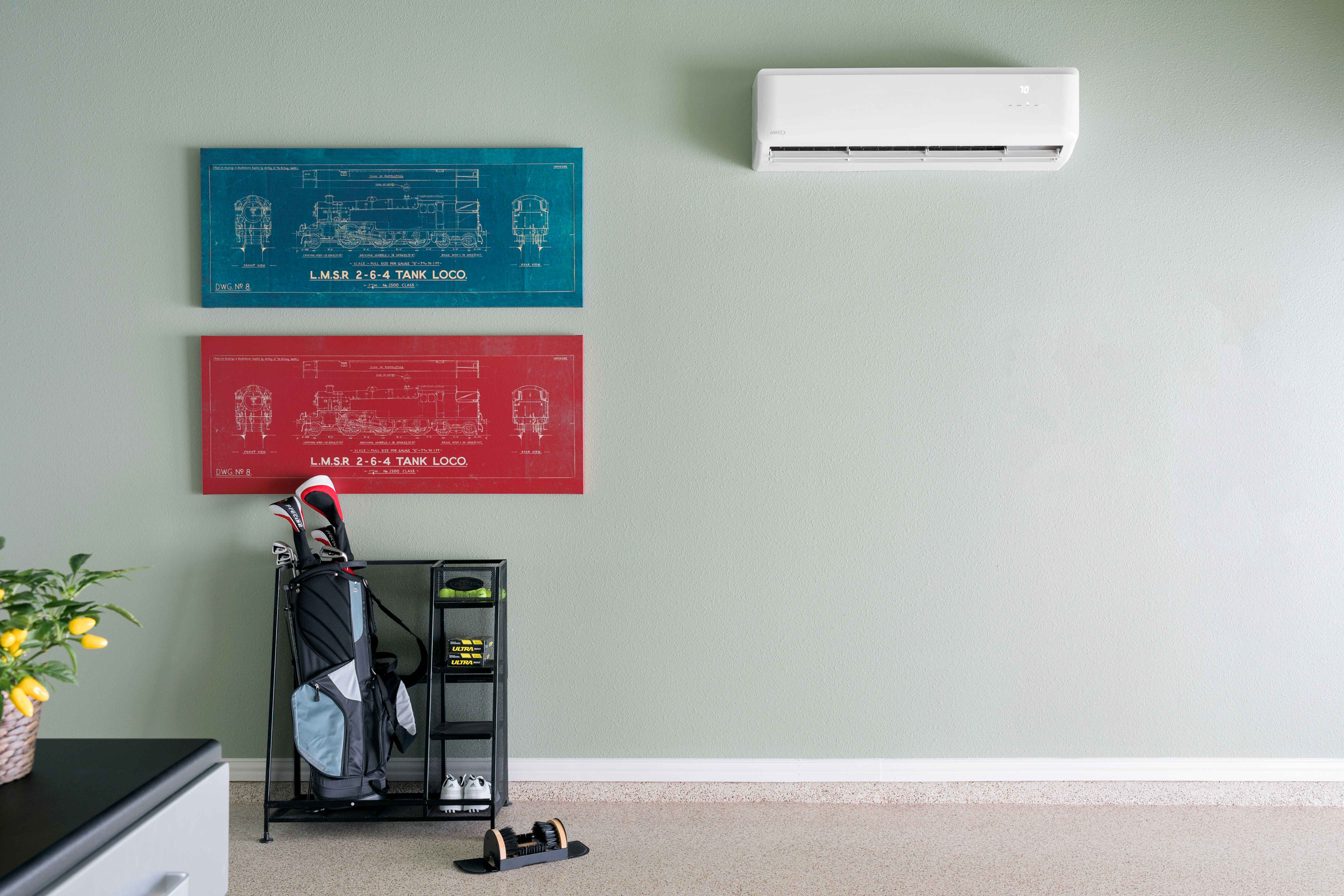 Air conditioning unit installed in a garage with organized storage space